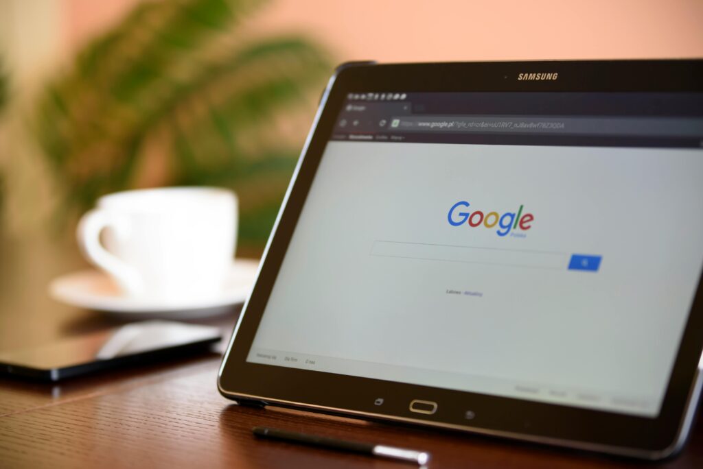 pexels photo 106341 106341 Samsung tablet on desk showing Google homepage, perfect for technology-related content.